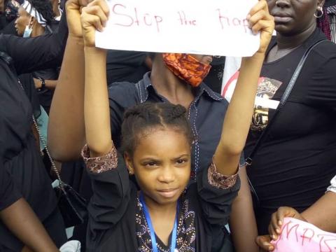 A child protesting against rape A child protesting against rape