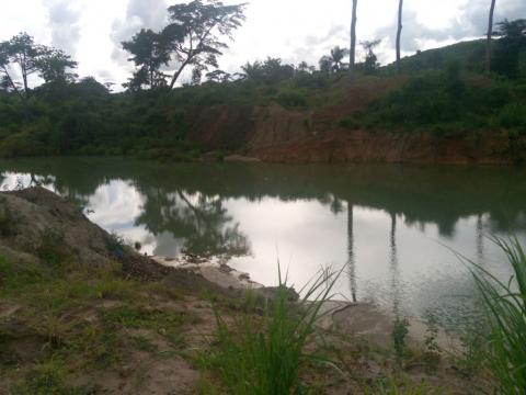 A mined-out pit outside Moigbedu Village, an old mining community in Sierra Leone’s Kono District. A mined-out pit outside Moigbedu Village, an old mining community in Sierra Leone’s Kono District.
