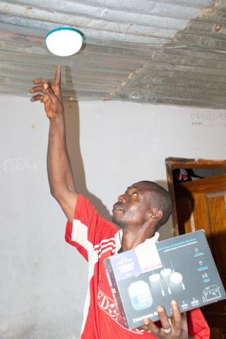 A resident electrifying his home in Mamakuma village A resident electrifying his home in Mamakuma village