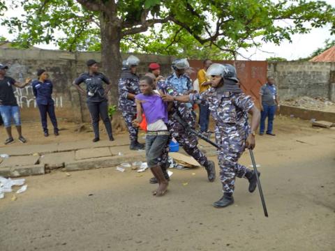An APC supporter being taken away An APC supporter being taken away