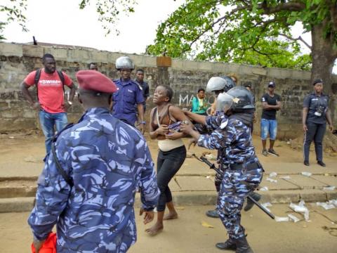 An APC supporter being taken away An APC supporter being taken away