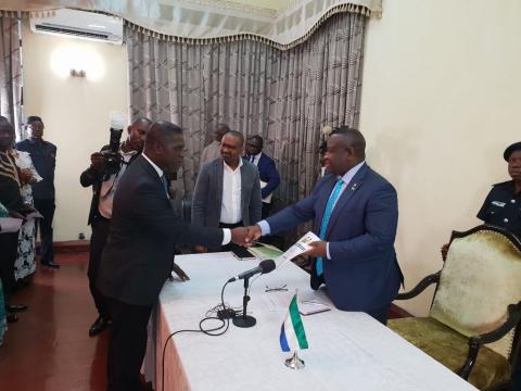 Sierra Leone's Chief Minister Prof David Francis (L) hands over the Transition report to President Julius Maada Bio Sierra Leone's Chief Minister Prof David Francis (L) hands over the Transition report to President Julius Maada Bio