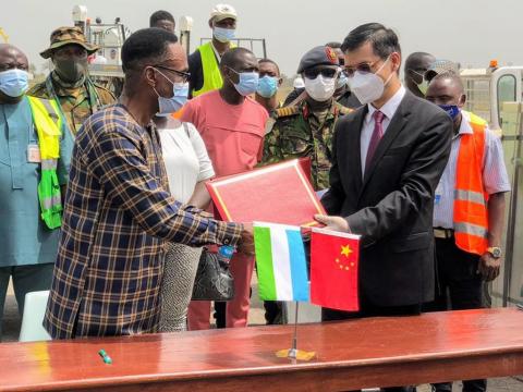 Chinese official handing over the Covid vaccines Chinese official handing over the Covid vaccines