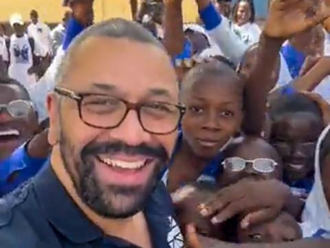 James Cleverly with children at a school in Bo James Cleverly with children at a school in Bo