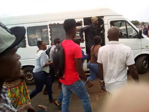 Commuters in wellington scramble for a place in a minibus Commuters in wellington scramble for a place in a minibus