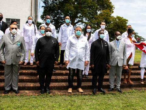 Cuban medics pose with President Bio after the meeting at State House Cuban medics pose with President Bio after the meeting at State House