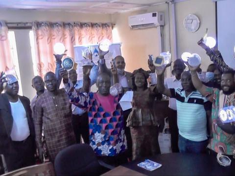 Deputy District Directors displaying solar lamps Deputy District Directors displaying solar lamps