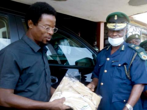Deputy director General handing the items to the NYSC officials Deputy director General handing the items to the NYSC officials