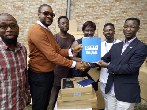 Evariste Sindayigaya of Plan presents donated items to officials of the First Lady's office Evariste Sindayigaya of Plan presents donated items to officials of the First Lady's office
