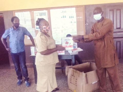 Focus 1000 staff and DMO rep during d donation Focus 1000 staff and DMO rep during d donation