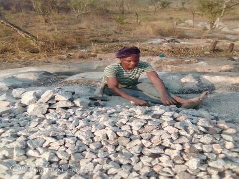 Manteneh Kargbo breaking stones at the Serekoliya Road Quarry.jpg Manteneh Kargbo breaking stones at the Serekoliya Road Quarry.jpg