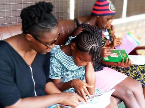 Makalay Saidiatu Sonda and kids studying Makalay Saidiatu Sonda and kids studying
