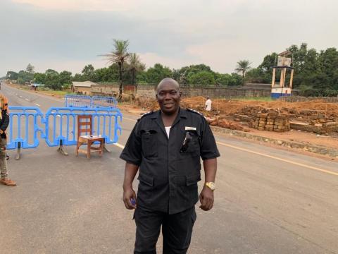 Officer-In-Charge, AB Kamara of the SLP poses in front of a checkpoint between Western Area and Port Loko District.-1 Officer-In-Charge, AB Kamara of the SLP poses in front of a checkpoint between Western Area and Port Loko District.-1
