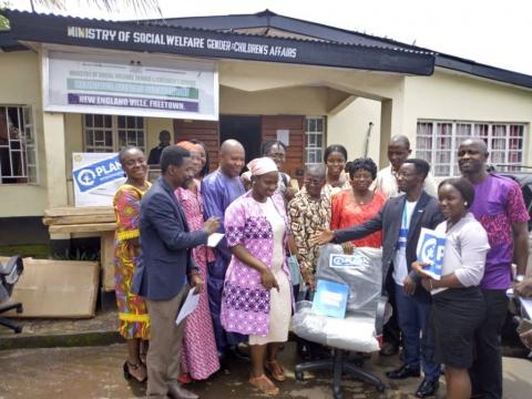 Officials of Plan donating items to officials of Ministry of Social Welfare Officials of Plan donating items to officials of Ministry of Social Welfare