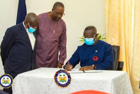 President Bio giving his assent as information minister and Attorney General look on President Bio giving his assent as Minister of Information and Attorney General look on
