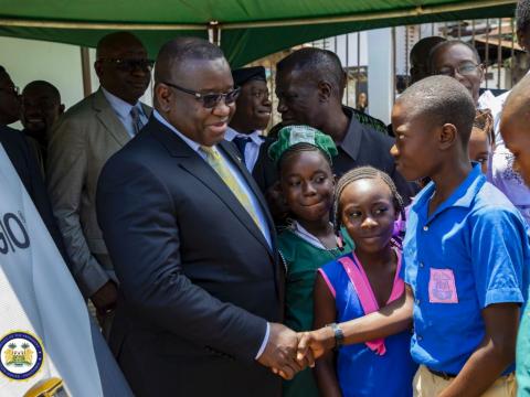 President Bio interacts with pupils at the State House ceremony President Bio interacts with pupils at the State House ceremony