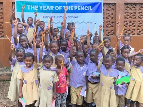 Students with their new pencils Students with their new pencils