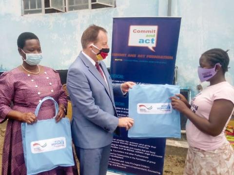 The German ambassador presenting the gifts to the children in Bo The German ambassador presenting the gifts to the children in Bo