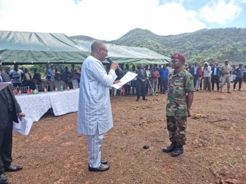 VP, Dr. Juldeh Jalloh handing over the land document to a military officer VP, Dr. Juldeh Jalloh handing over the land document to a military officer
